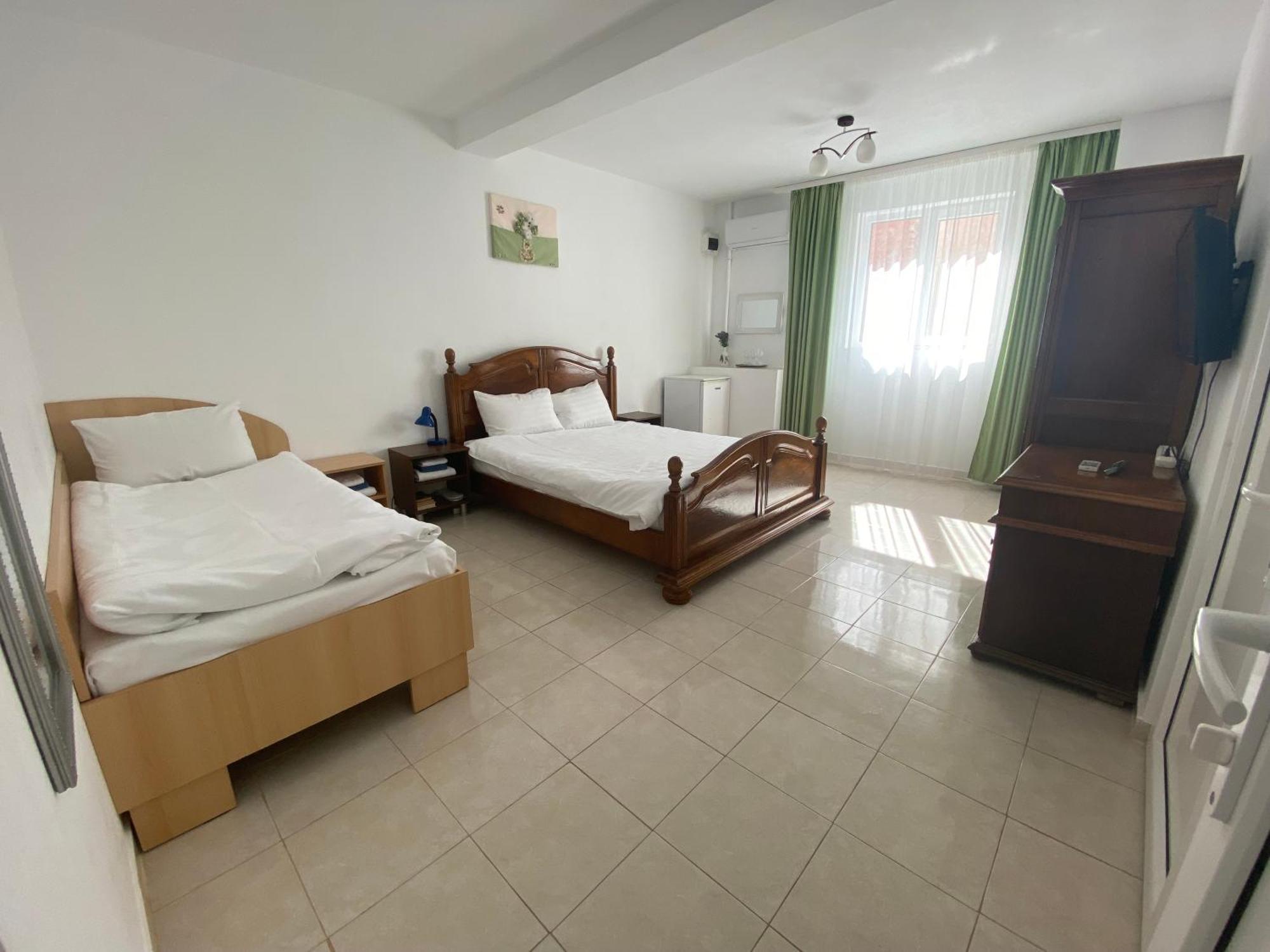 Gazde/Camere de închiriat Casa Double M,